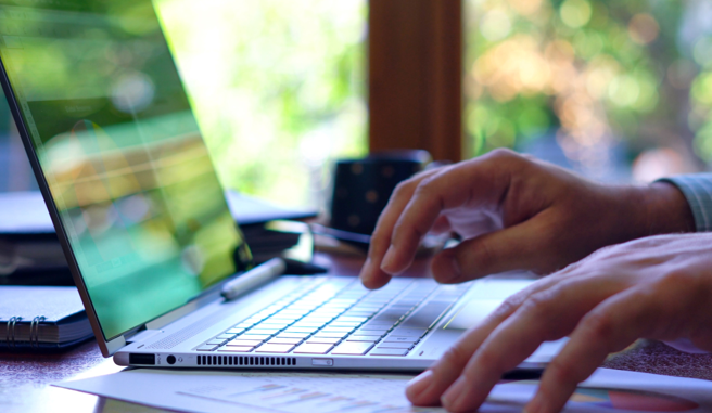 fingers on laptop image